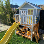 the Sunshine Shack cubby house with a slide - front angle