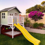 the Sunshine Shack cubby house with a slide - side angle