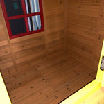 Inside wooden cubby house with red window